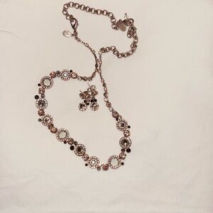 Elegant Sorrelli Necklace with pink crystals embellished with black stones.